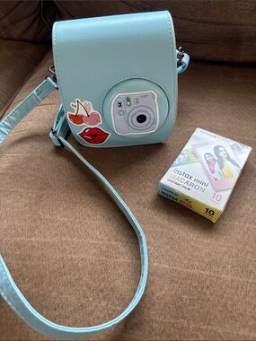 Fuji film Instax Light Blue Camera  and Crossbody Camera Case with Strap